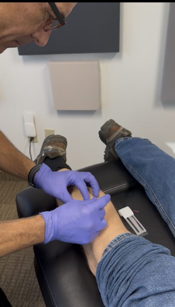 Dr. Jeff Manning performing dry needling at Manning Wellness Clinic in Dallas